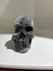 Dual-Tone Calcite Crystal Skull Stone Sculpture with Natural Quartz Cluster