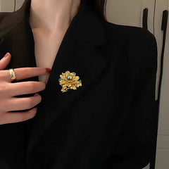 Luxury Gold Floral Brooch with Green Gemstones and Pearl