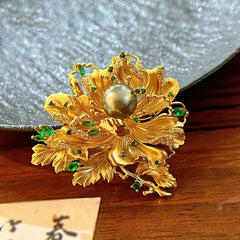 Luxury Gold Floral Brooch with Green Gemstones and Pearl