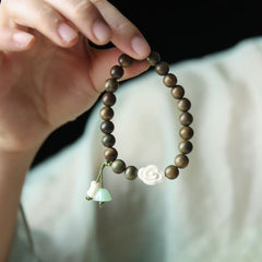 Green Sandalwood Bead Bracelet with Floral and Jade Charms