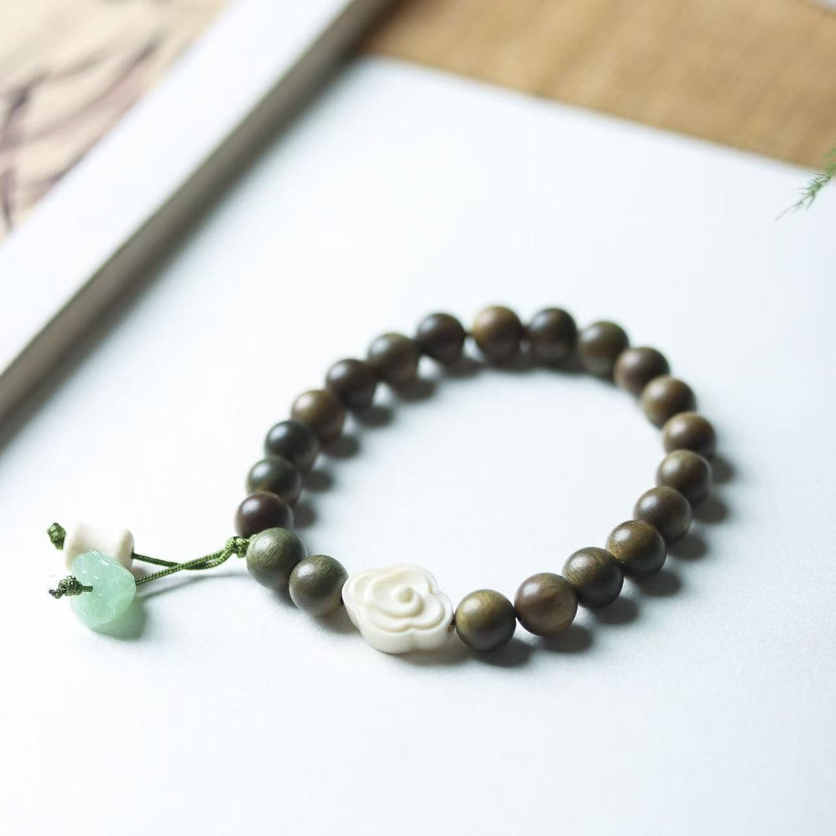 Green Sandalwood Bead Bracelet with Floral and Jade Charms