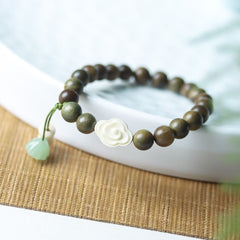 Green Sandalwood Bead Bracelet with Floral and Jade Charms