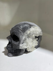Dual-Tone Calcite Crystal Skull Stone Sculpture with Natural Quartz Cluster