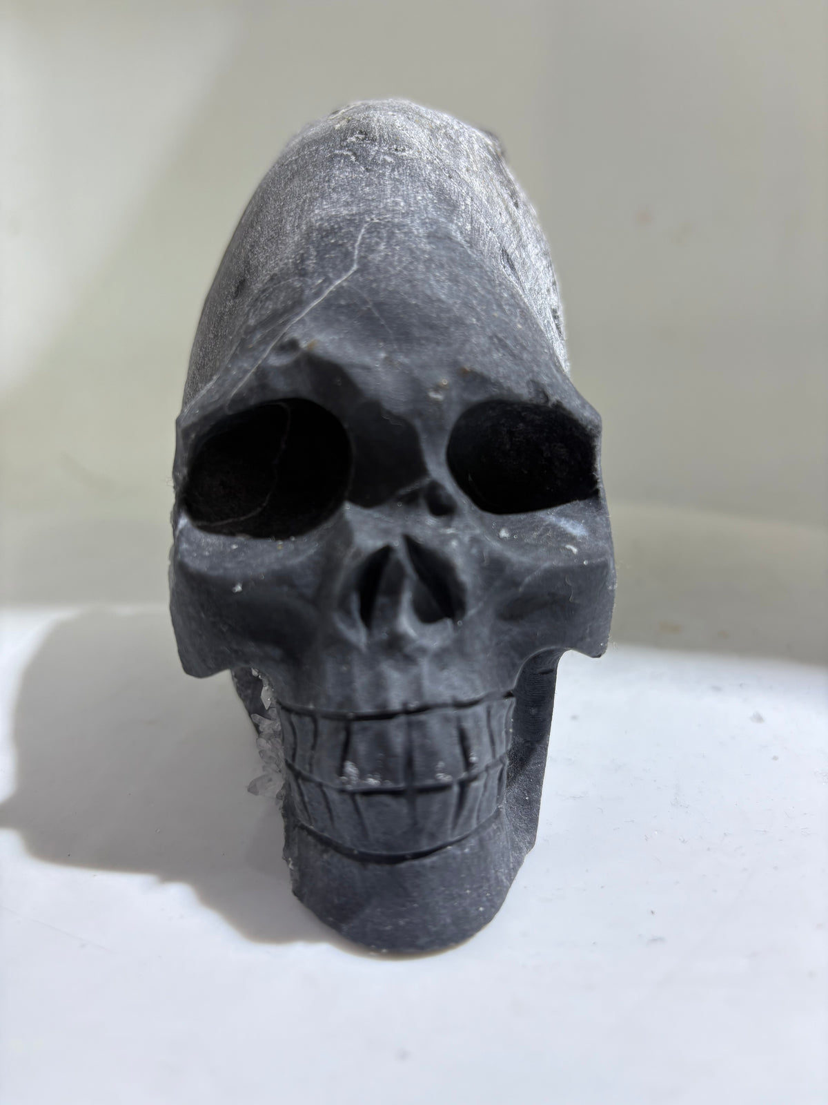 Obsidian Crest Calcite SkullCrystal Sculpture with Natural Frosted Finish