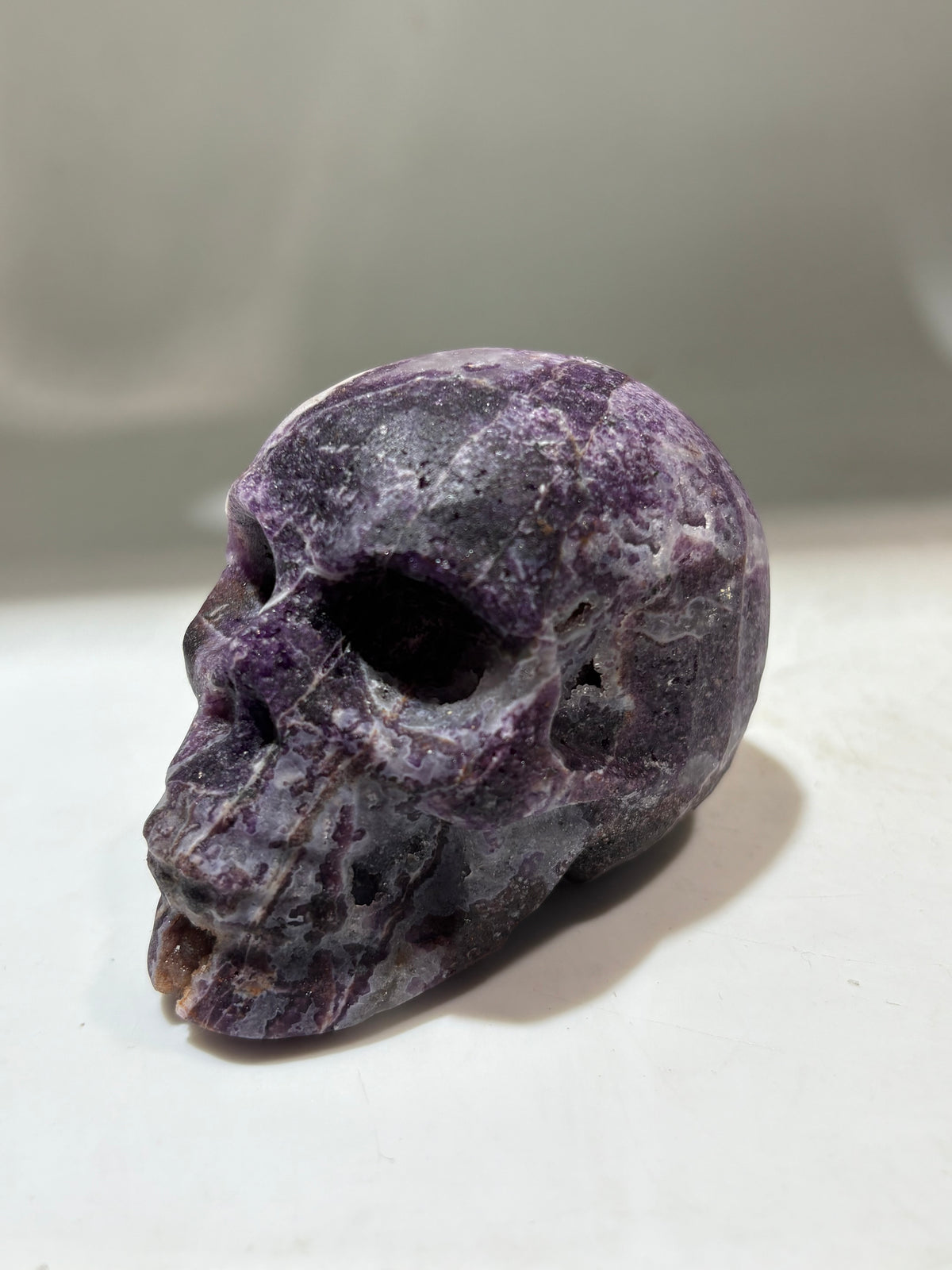 Violet Nebula Energy Gem Fluorite Skull – Crystal Sculpture with Swirling Lavender Patterns