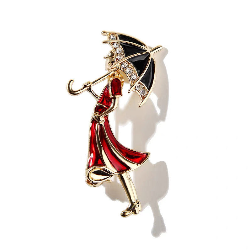 Red Dress Girl with Umbrella Brooch – Elegant Enamel Pin with Crystals